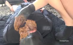 Smearing shit on slave's face