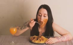 Tattooed babe eats poop from a plate