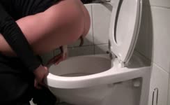 She shits over toilet