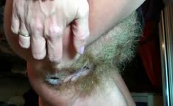 Hairy mature shitting in close up
